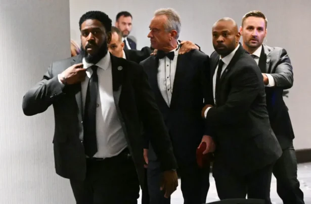 U.S. Secretary of Health and Human Services Robert F. Kennedy Jr. is rushed out by Secret Service agents after loud bangs were heard during the White House Correspondents' dinner at the Washington Hilton in Washington on April 25, 2026. (Mandel Ngan/AFP via Getty Images)