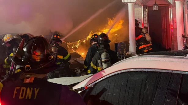 FDNY crews battled the blaze caused by an explosion at a residence in Queens, officials said. (Courtesy of FDNY)