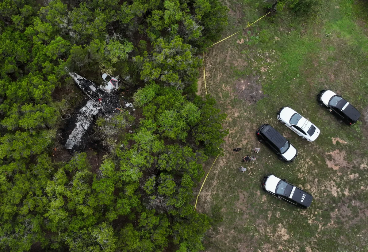 A crashed Cessna airplane in a wooded area on Round Rock Road in Wimberley, Texas, on May 1, 2026. (Jay Janner/Austin American-Statesman via AP)
