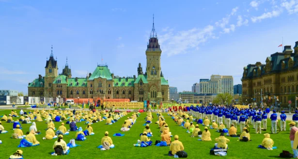 Falun Dafa practitioners hold an event to celebrate World Falun Dafa Day on Parliament Hill in Ottawa on May 5, 2026. (Jonathan Ren/The Epoch Times)