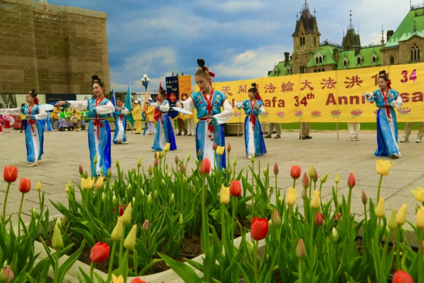 Young Falun Dafa practitioners participate in a dance performance as part of activities to celebrate World Falun Dafa Day on Parliament Hill in Ottawa on May 5, 2026. (Jonathan Ren/The Epoch Times)