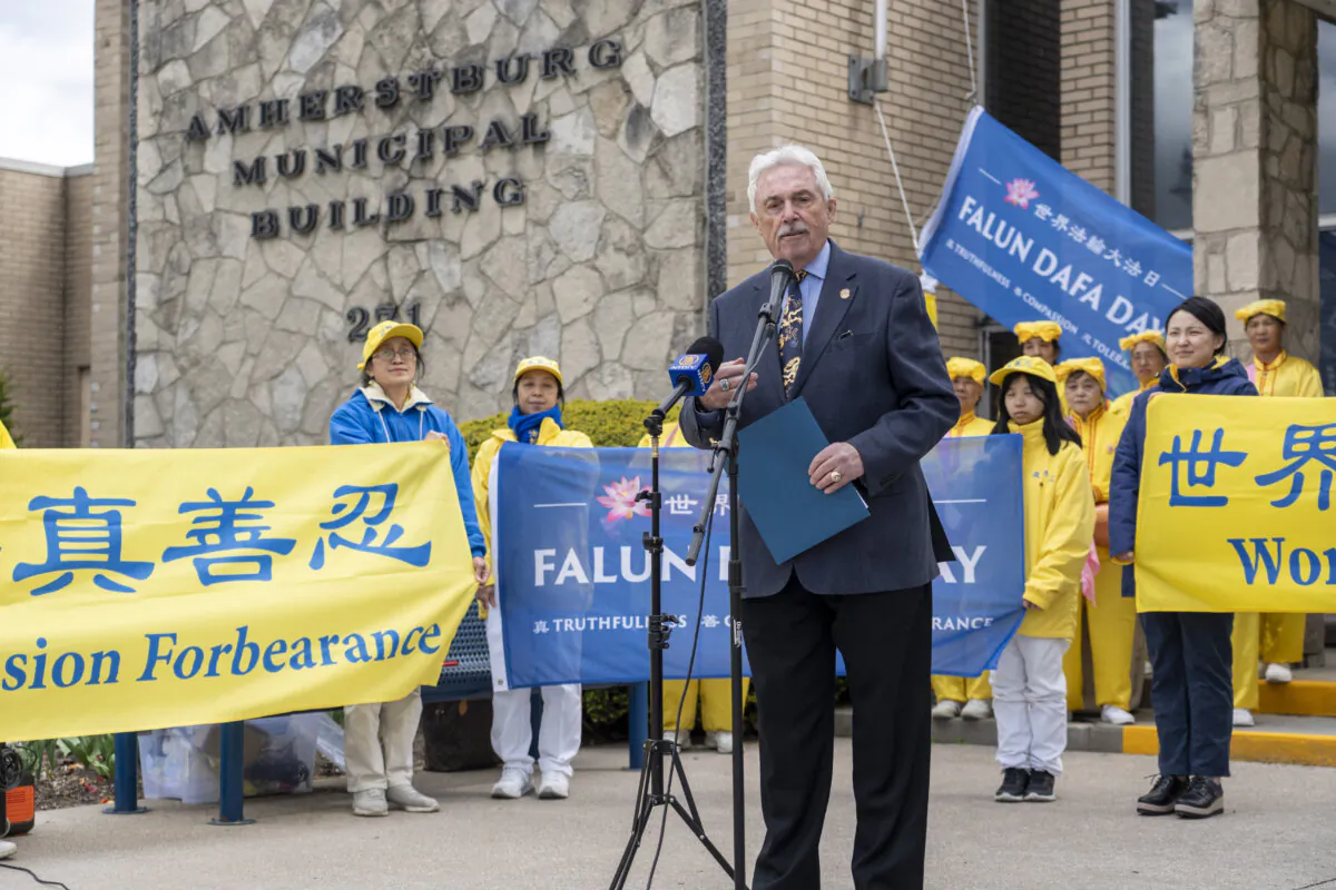 Michael Prue, mayor of Amherstburg, Ont., speaks at a Falun Dafa Day flag-raising ceremony outside the Amherstburg municipal building on April 30, 2026. (Evan Ning/The Epoch Times)