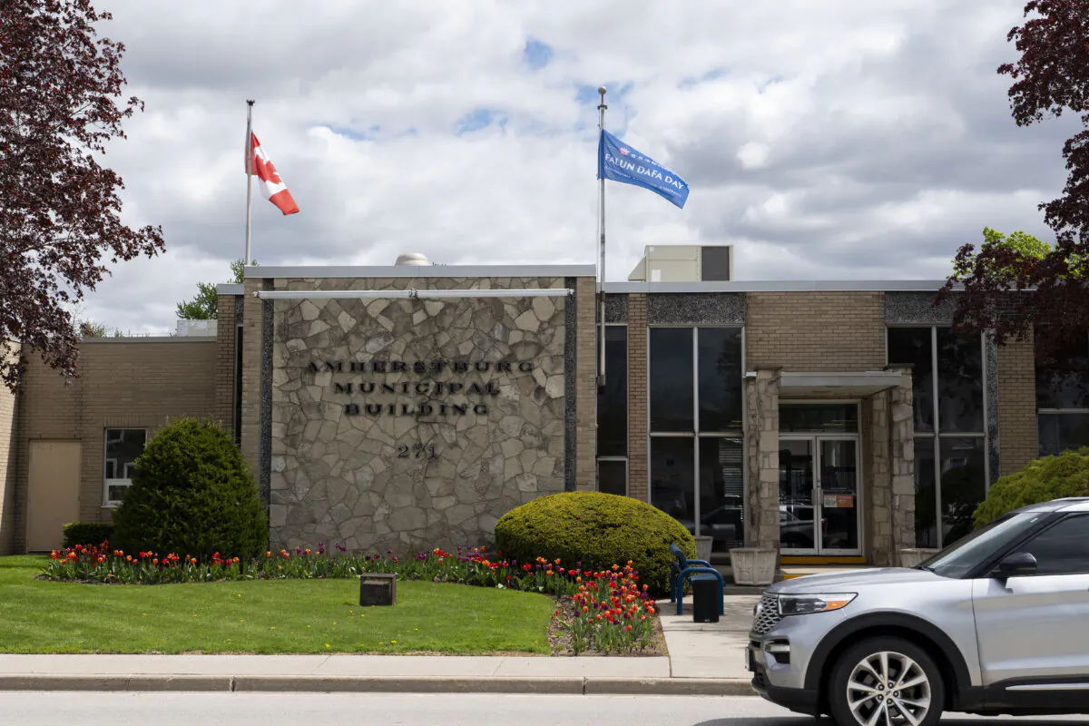 The Town of Amherstburg raised the Falun Dafa Day flag to commemorate Falun Dafa's 34th anniversary at a flag-raising ceremony on April 30, 2026. (Evan Ning/The Epoch Times)