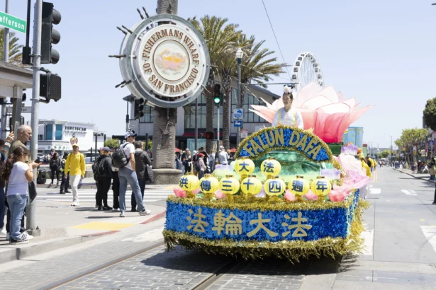 Hundreds of Falun Dafa practitioners, supporters held a parade in San Francisco on May 9, celebrating the 34th anniversary of World Falun Dafa Day. (Gary Wang/The Epoch Times)