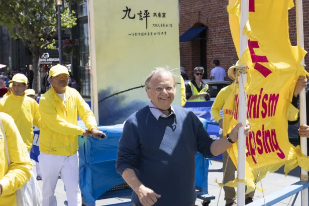 Retired seafood business owner Wayne Hankins in the parade line in San Francisco on May 9. (Lear Zhou/The Epoch Times)