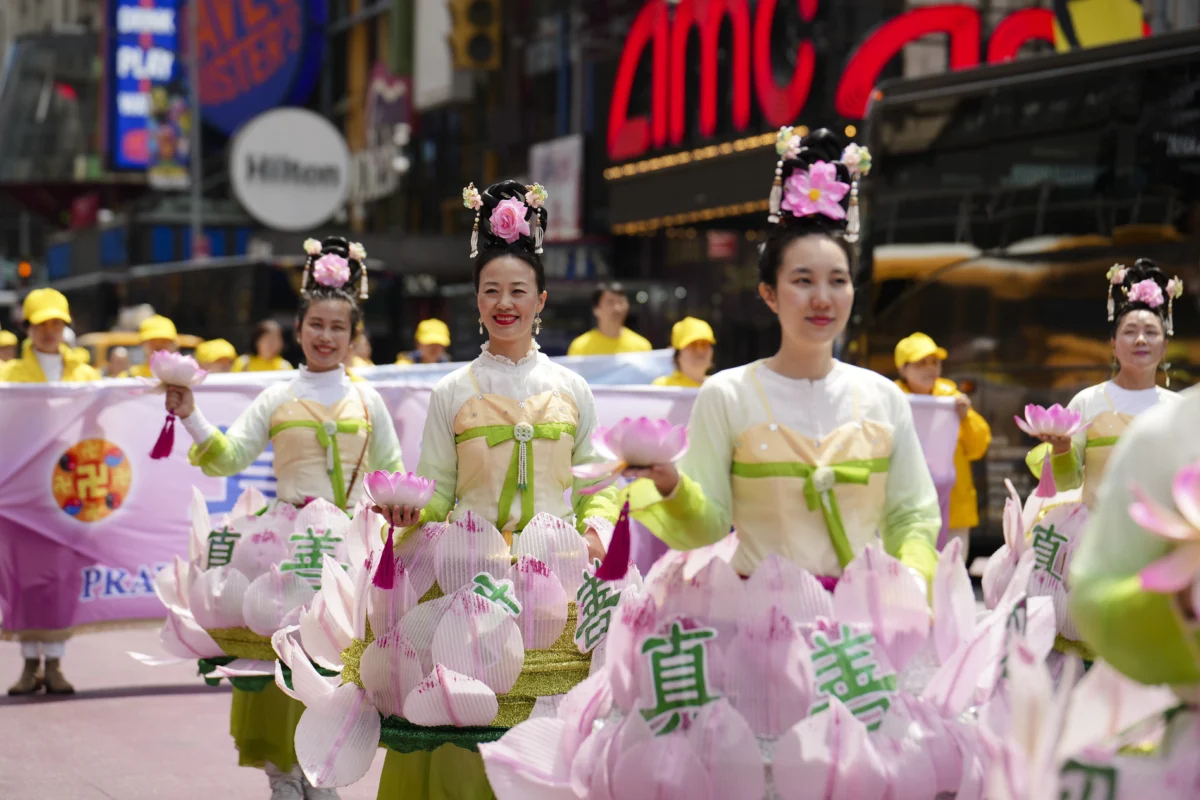 Falun Gong practitioners take part in a parade to celebrate World Falun Dafa Day and call for an end to persecution in China, in New York City on May 13, 2026. (Samira Bouaou/The Epoch Times)