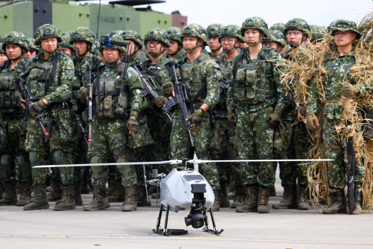 Soldiers stand next to a military unmanned aerial vehicle in Taichung, Taiwan, on Jan. 27, 2026. (I-Hwa Cheng/AFP via Getty Images)
