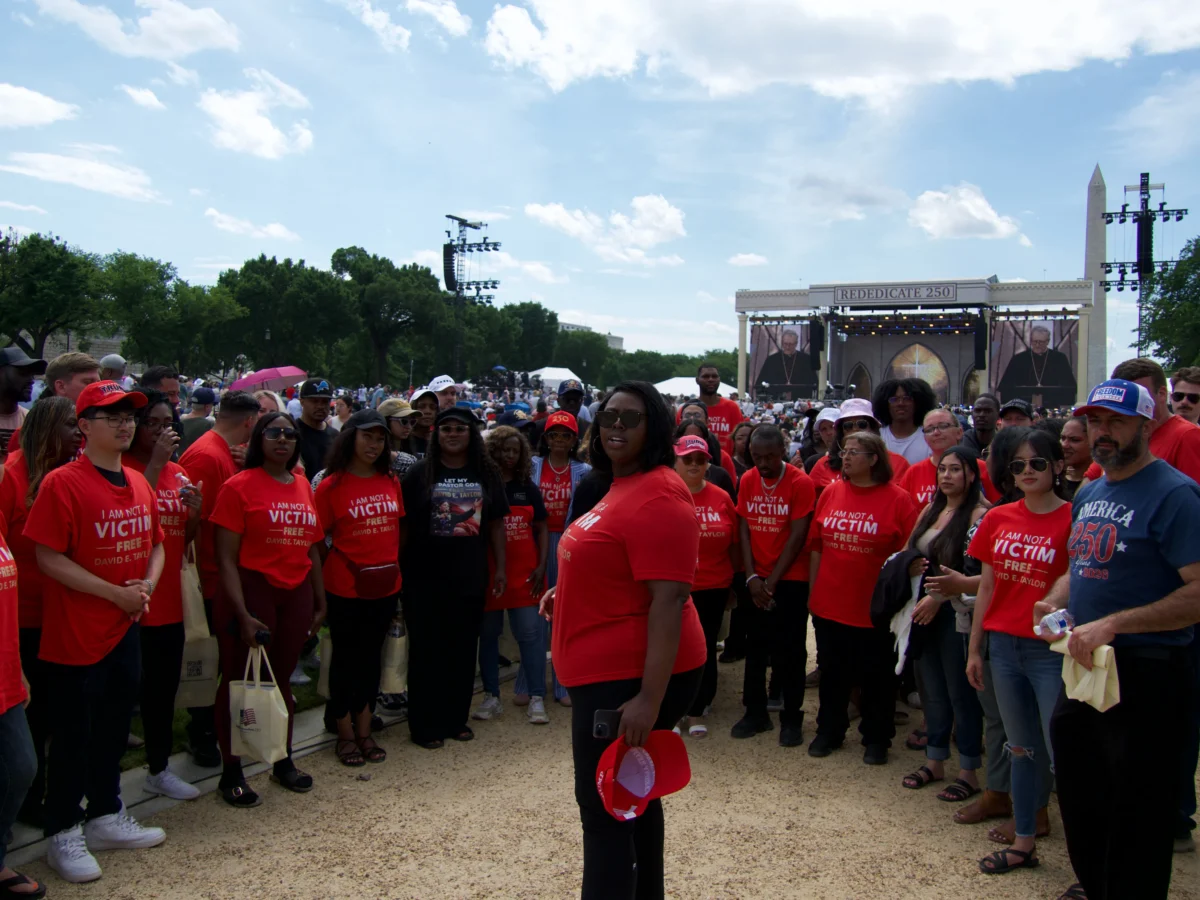 Kea Jones, center, and supporters of the Kingdom of God Church gather on the National Mall in Washington on May 17, 2026 for the Rededicate 250 celebration. (Travis Gillmore/The Epoch Times)