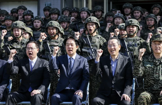 (L-R) Taiwanese National Security Council Secretary-General Joseph Wu, Taiwanese President Lai Ching-te, and Taiwanese Defence Minister Wellington Koo pose for photos with soldiers as they visit the troops during the Rapid Response Exercise at the Songshan military airbase in Taipei, Taiwan, on March 21, 2025. (I-Hwa Cheng/AFP via Getty Images)