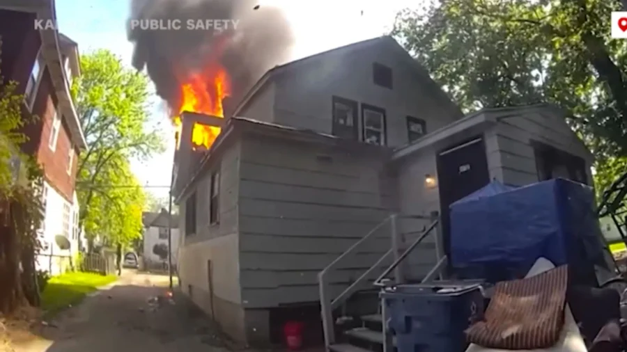 Police Officer Catches Baby Dropped From Window of Burning Home