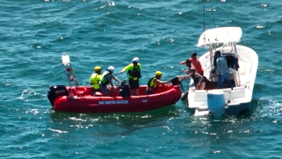 4 People and Their Dog Rescued After Boat Capsizes Off North Carolina