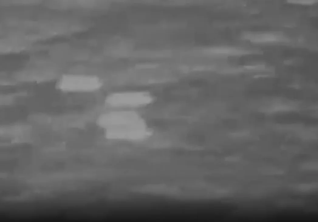 A screenshot from a video titled “UAP USO Formation.” USO stands for unidentified submerged object. (Department of War)