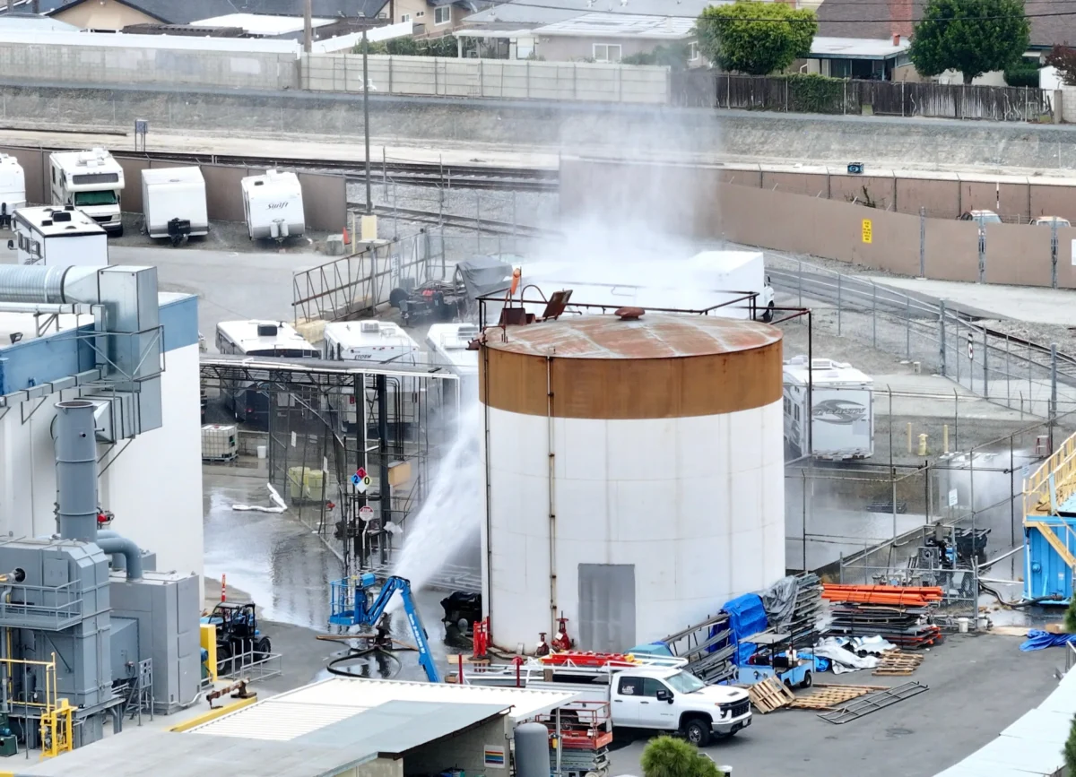 Water is sprayed on a tank that overheated at an aerospace plant in Garden Grove, Calif., on May 22, 2026. (Jeff Gritchen/The Orange County Register via AP)