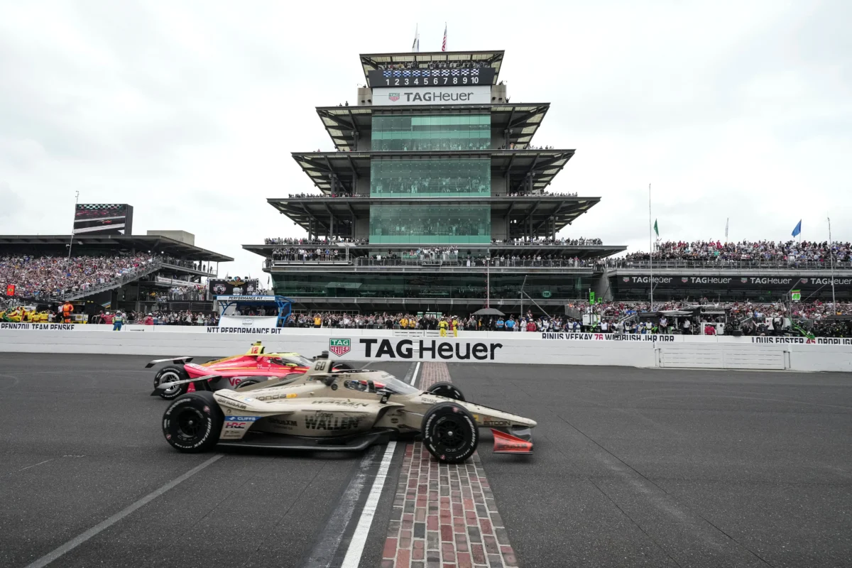 Felix Rosenqvist, foreground, of Sweden, beats David Malukas to the finish line to win the Indianapolis 500 auto race at Indianapolis Motor Speedway in Indianapolis on May 24, 2026. (AJ Mast/AP Photo)