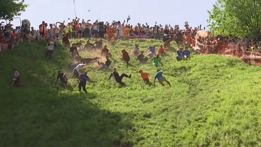 Revellers Risk Injury Racing Down Coopers Hill in Britain's Annual Cheese Rolling Competition