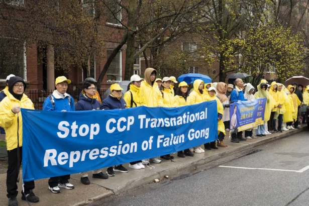 Falun Gong practitioners gather in front of the Chinese Consulate in Toronto to commemorate the 27th anniversary of their fellow practitioners' April 25, 1999, appeal in Beijing calling for freedom of belief. (Evan Ning/The Epoch Times)