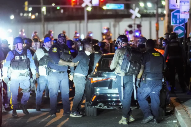NJ state police arrest a protester outside Delaney Hall, which is being used as an Immigration and Customs Enforcement (ICE) detention center, during a curfew, in Newark, N.J., on May 31, 2026. (Eduardo Munoz/AFP via Getty Images)