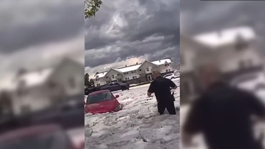 Police Save Woman From Floodwater After Hailstorm in Colorado