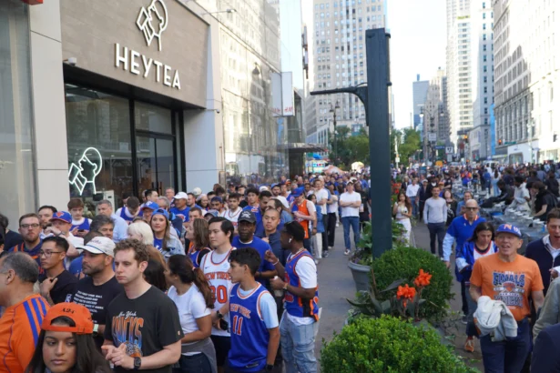 Ticket holders line up to gain entry to the security perimeter surrounding Madison Square Garden with President Donald Trump expected for Game 3 of Knicks vs. Spurs in the NBA Finals in New York on June 8, 2026. (Nicholas Zifcak/The Epoch Times)