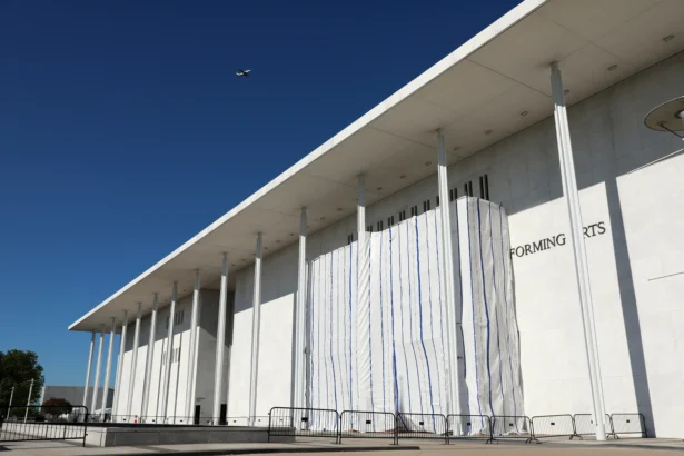 The wall of the John F. Kennedy Center for the Performing Arts is covered in tarp as work continues on the removal of President Donald Trump's name in Washington on June 13, 2026. (Rahmat Gul/AP Photo)