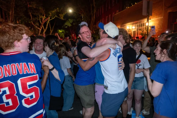 People celebrate after the New York Knicks beat the San Antonio Spurs in game 5 of the NBA finals, in New York City on June 13, 2026. (Spencer Platt/Getty Images)
