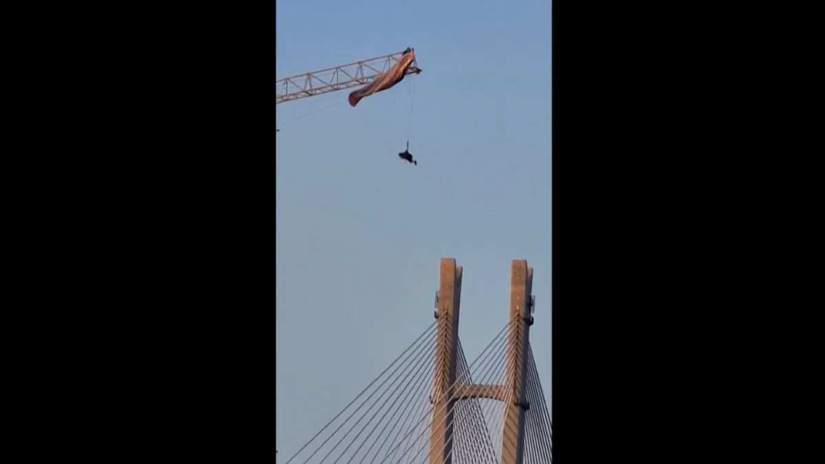 Paraglider Left Dangling After Getting Caught on a Crane in China's Sichuan Province