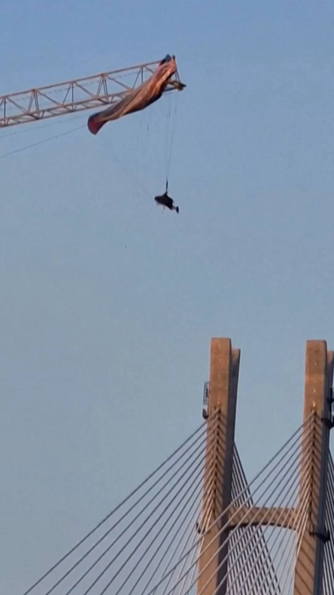 Paraglider Left Dangling After Getting Caught on a Crane in China's Sichuan Province