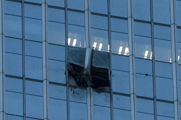 The surface of the CITIC Tower, also known as Zun Tower, is damaged in Beijing, China, on June 26, 2026. (Han Guan Ng/AP Photo)