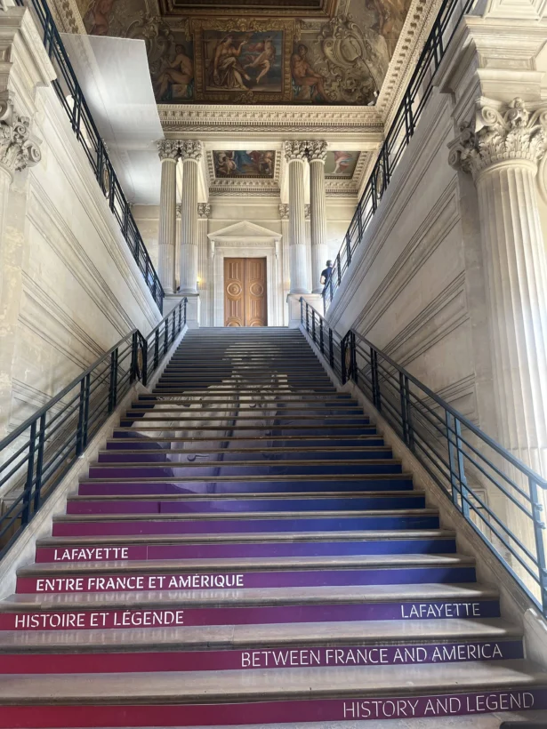 The staircase at the National Archives in Paris leading to the exhibition "Lafayette: Between France and America. Hostory and Legend." (Etienne Fauchaire/The Epoch Times)
