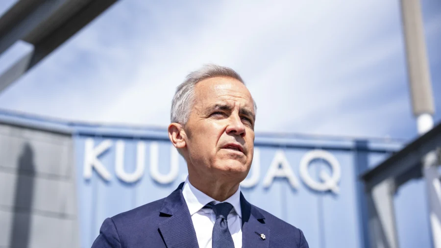 Carney Tours Military Base Before NATO Summit