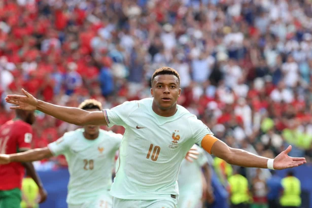 France's forward Kylian Mbappe celebrates scoring his team's first goal during the 2026 World Cup football tournament quarter-final match between France and Morocco at Boston Stadium in Foxborough, Mass., on July 9, 2026. (Odd Andersen/AFP via Getty Images)