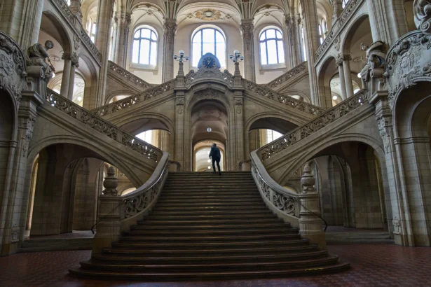 A man walks in the court on the day of the trial against an online predator network of men accused of using chat groups to share tips on how to drug and rape women, in Berlin, Germany on July 8, 2026. (Ebrahim Noroozi/AP Photo)