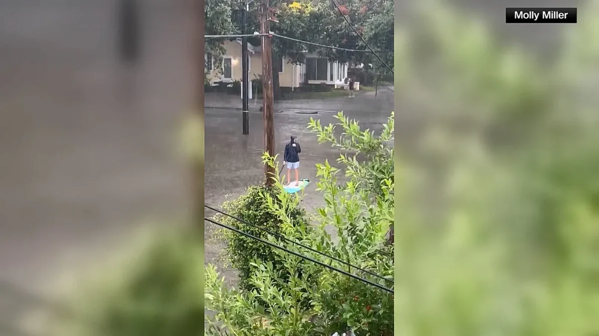 Person Goes Paddleboarding Through Flooded Streets in New Orleans