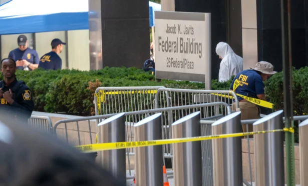 Law enforcement investigate the scene after an incendiary device went off outside of 26 Federal Plaza in Lower Manhattan in New York City on July 20, 2026. (Spencer Platt/Getty Images)