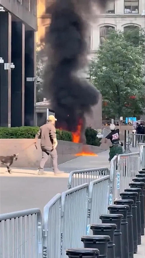 Video Footage Shows Suspect Throwing Object Into Fire at NYC Federal Building