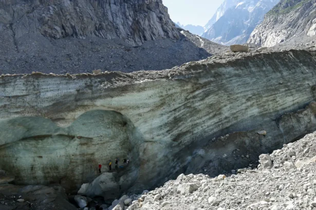Alpinists train in the shade on the side of an exposed portion of the Mer de Glace glacier during a Europe-wide summer heat wave near Chamonix-Mont-Blanc, France, on June 27, 2026. (Sean Gallup/Getty Images)