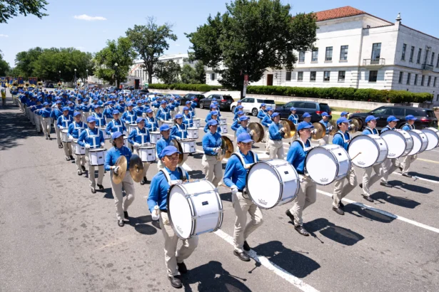 Falun Dafa practitioners take part in a march calling for the end of the Chinese Communist Party’s 27 years of persecution of Falun Gong in China, in Washington on July 23, 2026. (Larry Dye/The Epoch Times)