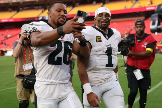Jalen Hurts #1 and Saquon Barkley #26 of the Philadelphia Eagles celebrate after defeating the Kansas City Chiefs in the game at Arrowhead Stadium on September 14, 2025 in Kansas City, Missouri. (Jamie Squire/Getty Images)