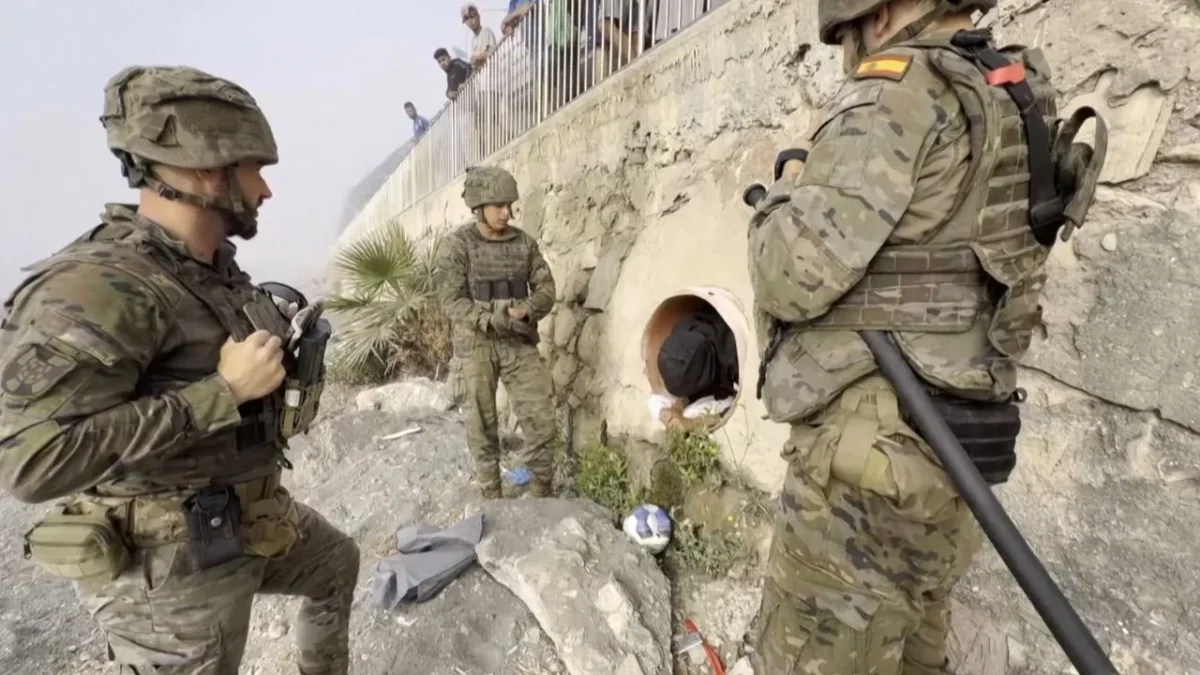 Migrant Found Hiding in Beach Tunnel After Mass Crossings Into Spanish Enclave