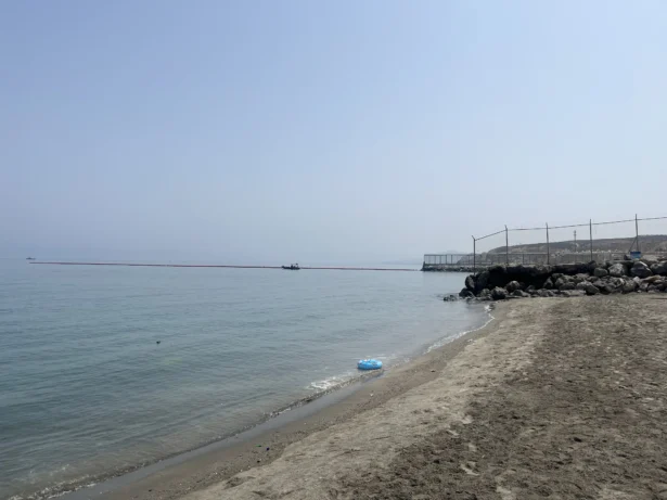 The newly-installed floating barrier off Tarajal beach at the Ceuta–Morocco maritime border on Aug. 1, 2026. (Etienne Fauchaire/The Epoch Times)