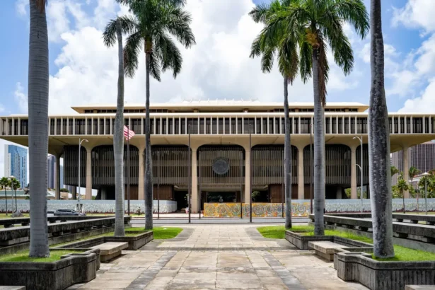 Palm trees frame the Hawaii State Capitol in Honolulu, Hawaii, on April 23, 2025. (AP Photo/Mengshin Lin, File)