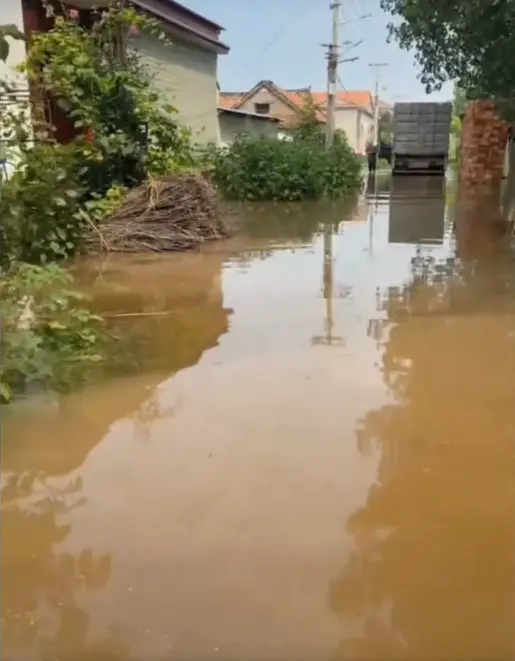Floodwater covers a road in Wangcao village in Fugou County, Henan Province, China, in August 2026. (Courtesy of interviewees)