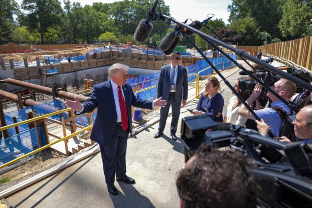 President Donald Trump speaks to the media alongside posters of his proposed White House ballroom amid construction at the White House in Washington on May 19, 2026. (Chip Somodevilla/Getty Images)