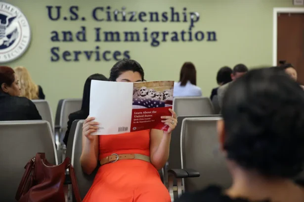 A Colombian immigrant studies ahead of her citizenship exam at the U.S. Citizenship and Immigration Services (USCIS) Queens office in the Long Island City neighborhood of the Queens borough of New York City on May 30, 2013. (John Moore/Getty Images)
