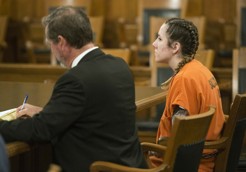 In this Aug. 6, 2018 file photo, Bailey Boswell, right, listens during a hearing in Saline County Court in Wilbur, Neb. Aubrey Trail who is on trial for the 2017 slaying of a Lincoln woman has slashed his neck and fallen from a wheelchair during court proceedings Monday, June 24, 2019. (Eric Gregory/Lincoln Journal Star/AP, Pool File)
