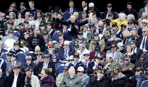 U.S. World War II veteran Jacques Michienzi (C) stands up among other veterans during a ceremony to mark the 75th anniversary of D-Day at the Normandy American Cemetery in Colleville-sur-Mer, Normandy, France, on June 6, 2019. (David Vincent/Photo/AP)