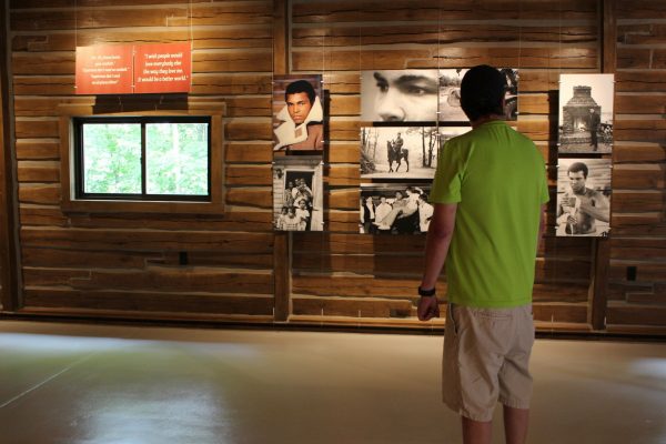 Ty Benner looks at a display in the gym at Fighter’s Heaven, Muhammad Ali’s training camp in Deer Lake, Pa., on June 8, 2019. (Michael Rubinkam/AP Photo)