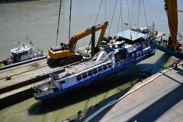 Officials conduct the recovery operation of the sunk shipwreck at Margaret Bridge, the scene of the fatal boat accident in Budapest, Hungary, on June 11, 2019. (Marton Monus/MTI via AP)