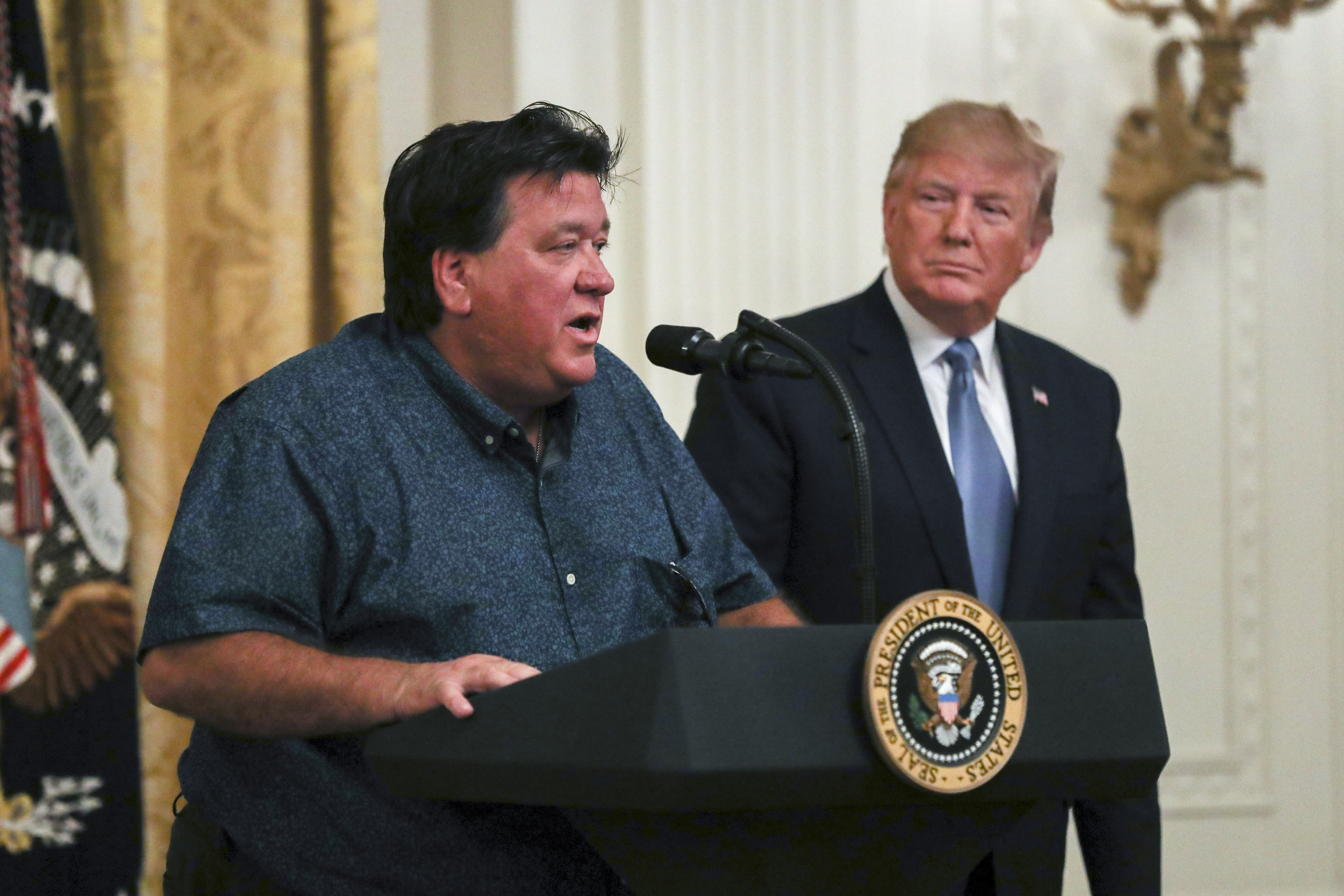 Bruce Roebuck, the owner of a bait and tackle business in Port St. Lucie, Fla., speaks at President Donald Trump’s environment initiatives event in the East Room of the White House in Washington on July 8, 2019. (Charlotte Cuthbertson/The Epoch Times)