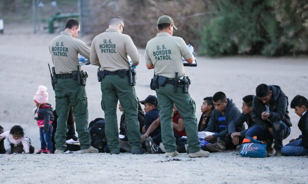 A group of illegal aliens is apprehended by Border Patrol after crossing from Mexico into Yuma, Ariz., on April 12, 2019. (Charlotte Cuthbertson/The Epoch Times)